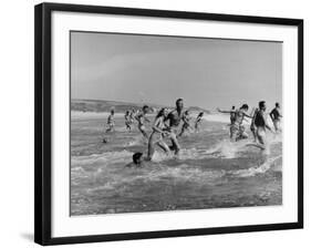 Lifeguards and Members of Womens Swimming Team Start Day by Charging into Surf-Peter Stackpole-Framed Photographic Print