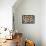 Light Bulb Symbol on Desk with Many Paper Balls-Stockphoto-Graf-Framed Stretched Canvas displayed on a wall