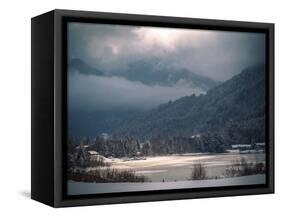 Light in the Winter Storm over Frozen Lake-Sheila Haddad-Framed Stretched Canvas