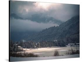 Light in the Winter Storm over Frozen Lake-Sheila Haddad-Stretched Canvas