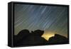 Light Pollution Illuminates the Sky and Star Tails Above Large Boulders-null-Framed Stretched Canvas