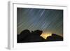 Light Pollution Illuminates the Sky and Star Tails Above Large Boulders-null-Framed Photographic Print