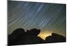 Light Pollution Illuminates the Sky and Star Tails Above Large Boulders-null-Mounted Photographic Print