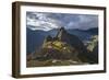 Light Streams Through The Clouds And Lights Parts Of The Ancient City Of Machu Picchu-Joe Azure-Framed Photographic Print