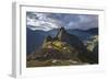 Light Streams Through The Clouds And Lights Parts Of The Ancient City Of Machu Picchu-Joe Azure-Framed Photographic Print