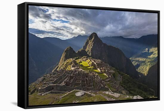 Light Streams Through The Clouds And Lights Parts Of The Ancient City Of Machu Picchu-Joe Azure-Framed Stretched Canvas