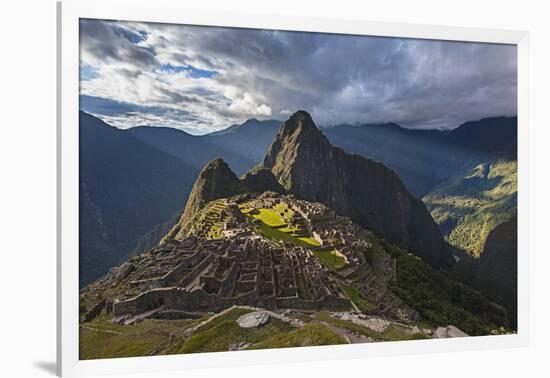 Light Streams Through The Clouds And Lights Parts Of The Ancient City Of Machu Picchu-Joe Azure-Framed Photographic Print