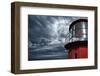 Lighthouse against  Stormy Sky.-NejroN Photo-Framed Photographic Print