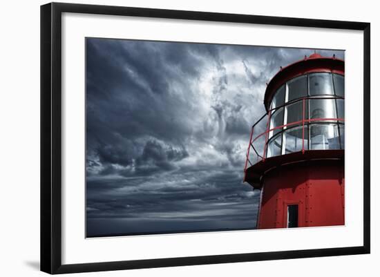 Lighthouse against  Stormy Sky.-NejroN Photo-Framed Photographic Print