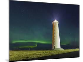 Lighthouse In Iceland With The Northern Lights Swrapping Around-Joe Azure-Mounted Photographic Print