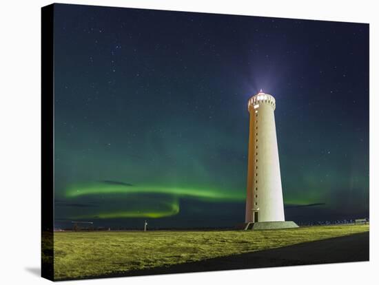 Lighthouse In Iceland With The Northern Lights Swrapping Around-Joe Azure-Stretched Canvas