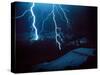 Lightning During a Storm over Snowy Mountains-null-Stretched Canvas