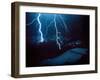 Lightning During a Storm over Snowy Mountains-null-Framed Photo