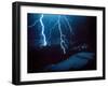 Lightning During a Storm over Snowy Mountains-null-Framed Photo