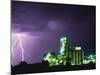 Lightning Striking near Factory in Texas-Paul Souders-Mounted Photographic Print