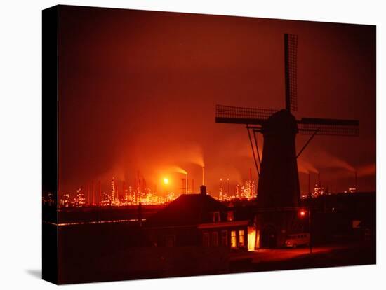 Lights and Fires of Pernis Refinery Glowing Behind Silhouetted Windmill-Ralph Crane-Stretched Canvas