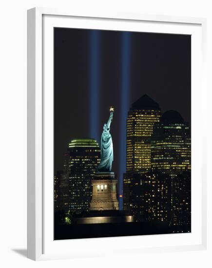 Lights from the Former World Trade Center Site Can be Seen on Both Sides of the Statue of Liberty-null-Framed Premium Photographic Print