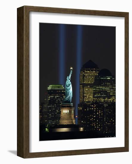 Lights from the Former World Trade Center Site Can be Seen on Both Sides of the Statue of Liberty-null-Framed Photographic Print