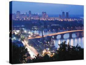 Lights Illuminating Podil District and Dnieper River Area at Night, Kiev, Ukraine, Europe-Christian Kober-Stretched Canvas