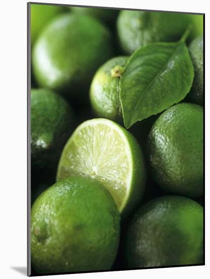 Limes, Several Whole and One Halved-Vladimir Shulevsky-Mounted Photographic Print