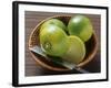 Limes, Two Whole and One Halved in a Small Basket-Eising Studio - Food Photo and Video-Framed Photographic Print