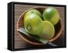 Limes, Two Whole and One Halved in a Small Basket-Eising Studio - Food Photo and Video-Framed Stretched Canvas