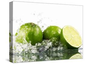 Limes with Splashing Water-Michael L?ffler-Stretched Canvas