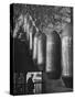 Line of 500 lbs Bombs Jiggling Along on Overhead Conveyor Hooks Abover Worker-Andreas Feininger-Stretched Canvas