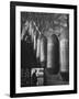 Line of 500 lbs Bombs Jiggling Along on Overhead Conveyor Hooks Abover Worker-Andreas Feininger-Framed Photographic Print