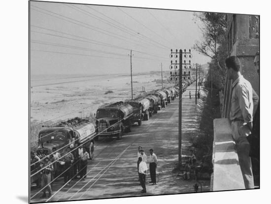 Line of Caltex Oil Trucks with Armed Escort on Road During Government Crisis-null-Mounted Photographic Print