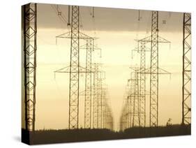 Line of High Tension Electrical Towers at Dusk-null-Stretched Canvas