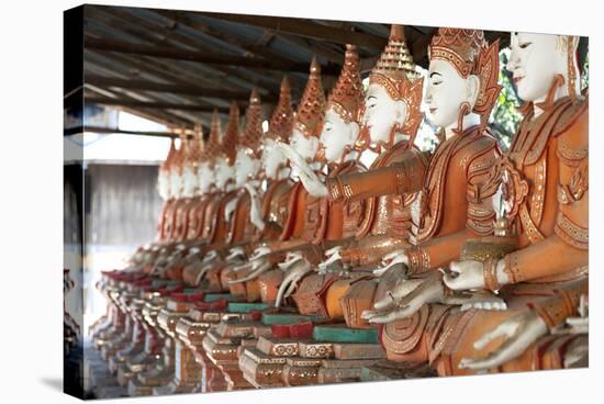Line of Seated Buddhas at the Maha Bodhi Ta Htaung Monastery, Sagaing Division, Myanmar (Burma)-Annie Owen-Stretched Canvas