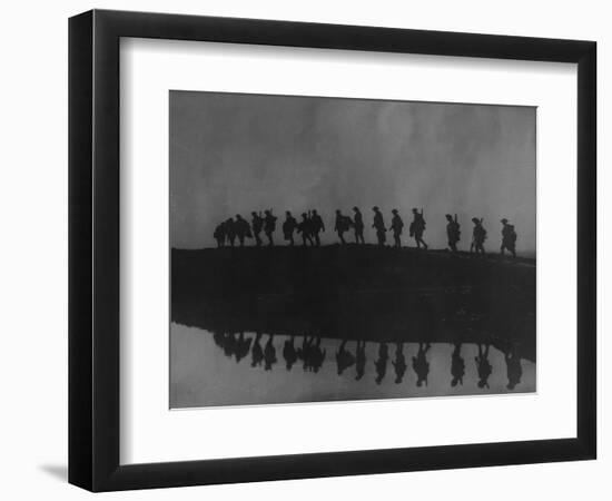 Line of Soldiers on Ridge Silhouetted Against Sky Reflected from River Beside Them-null-Framed Photographic Print