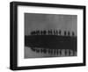 Line of Soldiers on Ridge Silhouetted Against Sky Reflected from River Beside Them-null-Framed Photographic Print