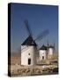 Line of Windmills Above the Village of Consuegra, Ruta De Don Quixote, Castile La Mancha, Spain-Michael Busselle-Stretched Canvas