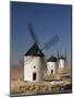 Line of Windmills Above the Village of Consuegra, Ruta De Don Quixote, Castile La Mancha, Spain-Michael Busselle-Mounted Photographic Print