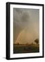 Lion (Panthera leo) adult male, resting in habitat, with stormclouds and rainbow, Chief's Island-Shem Compion-Framed Photographic Print