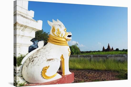 Lion Statue and Temple on Bagan Plain, Bagan (Pagan), Myanmar (Burma), Asia-Christian Kober-Stretched Canvas