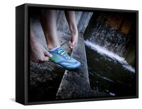 Lisa Eaton Laces Up Her Running Shoe Near a Water Feature at Freeway Park - Seattle, Washington-Dan Holz-Framed Stretched Canvas