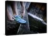 Lisa Eaton Laces Up Her Running Shoe Near a Water Feature at Freeway Park - Seattle, Washington-Dan Holz-Stretched Canvas