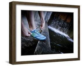 Lisa Eaton Laces Up Her Running Shoe Near a Water Feature at Freeway Park - Seattle, Washington-Dan Holz-Framed Photographic Print