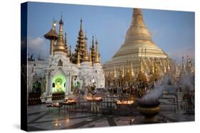 Lit Candles Placed by Devotees at Sunset at the Shwesagon Pagoda, Yangon, Myanmar (Burma)-Annie Owen-Stretched Canvas