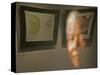 Lithograph by Nelson Mandela is Seen Reflected on a Photographic Portrait of Mandela-null-Stretched Canvas