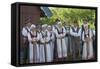 Lithuania, Curonian Spit, Nida, People Wearing Traditional Costumes Singing Outside House-null-Framed Stretched Canvas