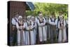 Lithuania, Curonian Spit, Nida, People Wearing Traditional Costumes Singing Outside House-null-Stretched Canvas