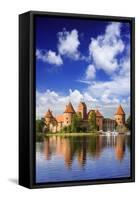 Lithuania, Vilnius. Trakai Castle reflected Galve lake in Lithuania-Miva Stock-Framed Stretched Canvas