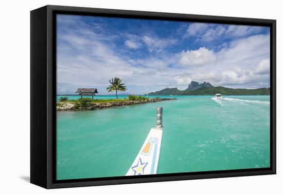 Little boat in the turquoise lagoon of Bora Bora, Society Islands, French Polynesia, Pacific-Michael Runkel-Framed Stretched Canvas