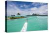 Little boat in the turquoise lagoon of Bora Bora, Society Islands, French Polynesia, Pacific-Michael Runkel-Stretched Canvas