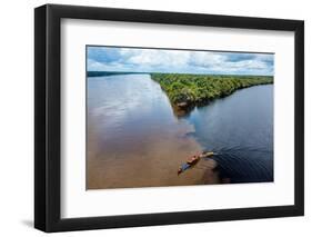 Little boat on the meeting point of the Casiquiare River and black Pasimoni River-Michael Runkel-Framed Photographic Print