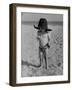 Little Boy at the Beach Wearing a Oversized Cowboy Hat Playing with a Toy Pistol-Ralph Crane-Framed Photographic Print